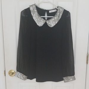 Top with sheer sleeves